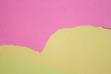 Pink torn paper background. Ripped paper on a yellow background. Copy space for text.
