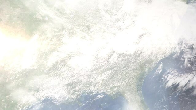 Earth zoom in from outer space to city. Zooming on Decatur, Alabama, USA. The animation continues by zoom out through clouds and atmosphere into space. Images from NASA