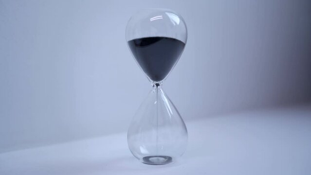 Hourglass with sand - The concept of time. 