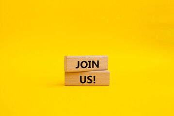Join us symbol. Concept word Join us on wooden blocks. Beautiful yellow background. Business and...