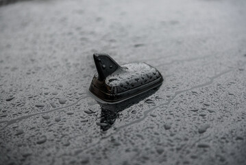 GPS antenna on roof of a car for radio navigation system. Antenna on top of black car. Outdoor car...