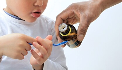 boy taking medicine on white background with people stock image stock photo