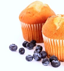 blueberry muffins on a table with white background no people stock image stock photo