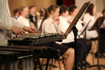 A musician playing the xylophone in a school orchestra a close-up image of a musical instrument percussion - obrazy, fototapety, plakaty