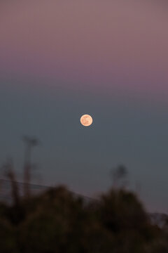 Scenic sunset sky with full moon in highland