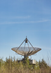The metal structure of the astronomical radio telescope observatory on the territory of the Institute of the Ionosphere in the Kharkov region, on a spring sunny day