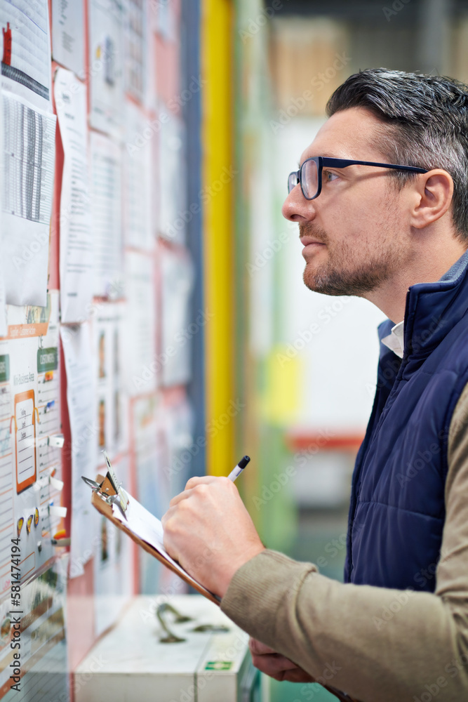 Poster organized in every detail. a man working in a large warehouse.