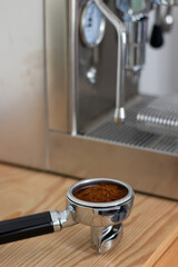 Ground coffee in portafilter and espresso coffee machines