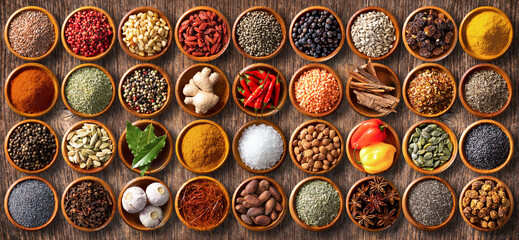 Colourful background from various herbs and spices for cooking in bowls - obrazy, fototapety, plakaty