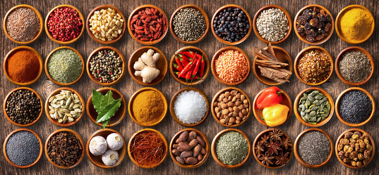 Colourful background from various herbs and spices for cooking in bowls