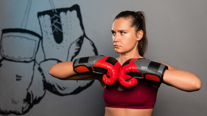 Portrait of a sporty woman in boxing gloves