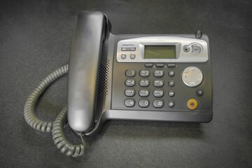 Dect cordless phone wireless phone, radiotelephone, radio phone on grey background.