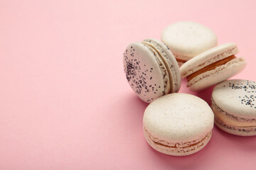 Cake macaron or macaroon on pink background. Space for text