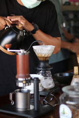 barista brewing coffee, pour over coffee