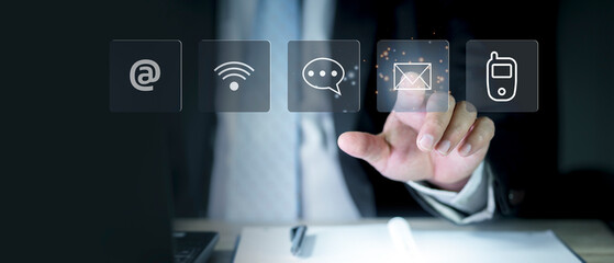 Businessman using laptop pc with contact icons on virtual screen. searching web, browsing...