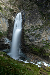 a large waterfall in a rock in the austrian alps in the hohe tauern mountains