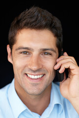 Technology is the best form of development. Portrait of a smiling young man keeping in touch with his loved one.