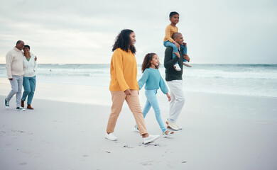 Grandparents, parents and children walking on beach enjoying holiday, travel vacation and weekend...