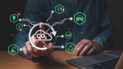 Entrepreneur hand point at digital screen dashboard while control and reduce carbon emission for global friendly business. Business with environment concern, carbon credit and zero emission.