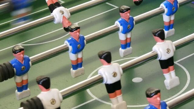 Table foosball soccer. Sport team football players game. Table football for stand game playing. White and blue football players miniatures dolls retro games. For sports entertainment and recreation.