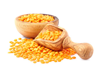 Lentils in wooden bowl on white  background. Red lentils closeup. Balanced diet, cooking, vegetarian, raw and clean eating concept. Healthy food.