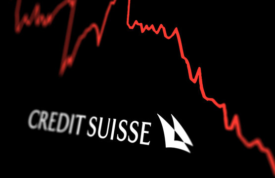 White Credit Suisse logo on a stock market performance chart trend