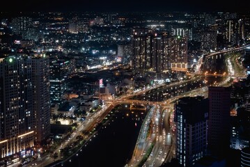 Fototapeta na wymiar Illuminated skyscrapers at night city