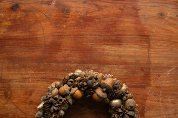 Wooden background,  decoration from forest materials, wreath of cones