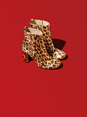 A bright color contrast created by the red background. Elegant high heel shoes with a leopard print for those, who is into a modern casual, but daring fashion style which a spring season brings.