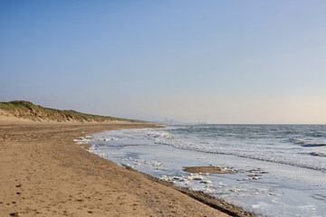 Panorama of the North Sea beach with the city of The Hague on the horizon. Wassenaar, The Netherlands. 