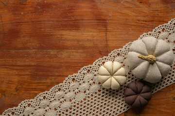 Easter decoration, pumpkins on the wooden background 