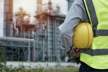 worker with helmet. workers at work. industrial workers at work. industrial workers in factory. worker in helmet. refinery worker.