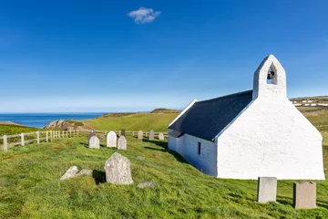 Foto op Canvas The Church of the Holy Cross at Mwnt, a parish church and Grade I listed building on the Ceredigion coastline in Wales. © Jim