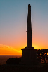 Fototapeta premium Sunset with a silhouette of a war memorial at Mount Bogenberg, Bogen, Danube, Bavaria, Germany