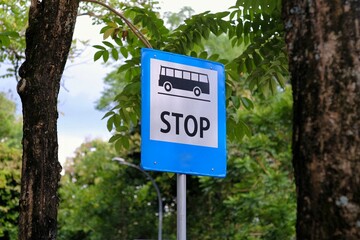 Stop sign for bus public transport on roadside.