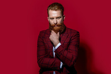 Fototapeta premium caucasian man in formalwear suit on background. photo of man in formalwear suit with beard.