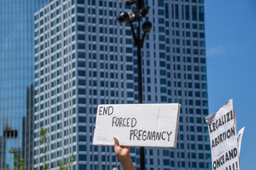 Protests holding pro-abortion signs at demonstration in response to the Supreme Court Dobbs ruling...