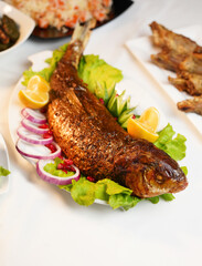 Traditional Azerbaijani meal "Balig Levengi", a kind of dish prepared with fish, walnut onion mix inside