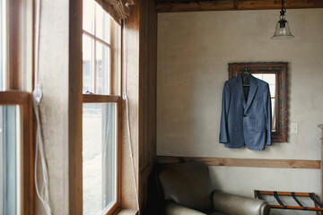Fototapeta na wymiar Suit jacket hanging up in room