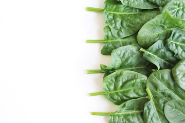 fresh leaves spinach on white. background of green spinach leaves. spinach leaves on white isolated...