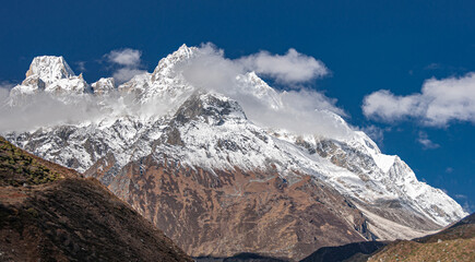 Fototapeta premium Larkya Peak, 6249 m, as seen from Manaslu Circuit trail to Larkya Phedi camp from Samdo village, Manaslu Himal range, Gorkha district, Nepal Himalayas, Nepal