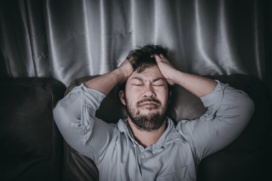 Asian Handsome Man Stress From Work Overload,Tired Male Come Back Home After A Lot Of Work From Company,risk Of Depression