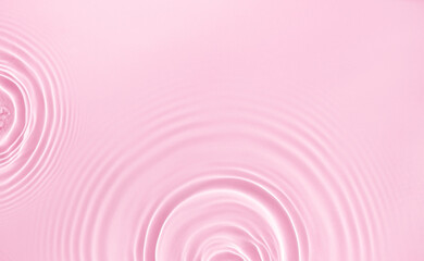 water texture ripples wave clean transparent water abstract background in pink color