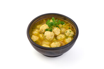 Dietary soup with chicken meatballs, isolated on white background.