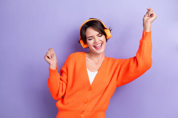 Photo of cheerful positive lady wear orange trendy clothes eyes closed raised hands good mood...