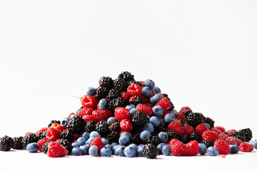Blueberries, blackberries, raspberries on a white background