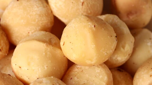 macadamia nuts turning slowly in close-up