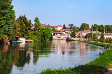 Fototapeta na wymiar Bernate Ticino,a farming village on the outskirts of Milan overlooking the canal in springtime