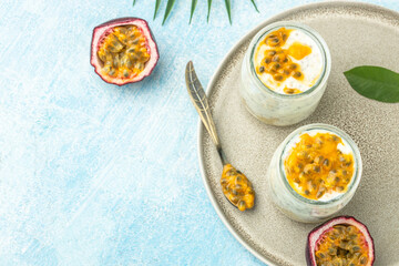 Yogurt with passion fruit. Vegan or gluten free diet. banner, menu, recipe place for text, top view