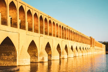 Selbstklebende Fototapete Khaju-Brücke Isfahan, Iran - May 2022: SioSe Pol or Bridge of 33 arches, one of the oldest bridges of Esfahan and longest bridge on Zayandeh River